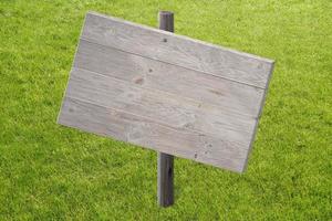 Empty Wooden Board on Grass photo