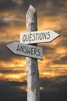 Questions and Answers - Wooden Signpost with Two Arrows and Sunset Sky photo