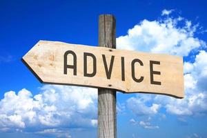 Advice - Wooden Signpost with one Arrow, Sky with Clouds in Background photo