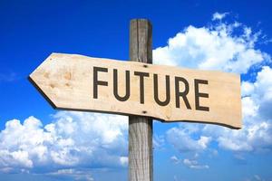 Future - Wooden Signpost with one Arrow, Sky with Clouds in Background photo