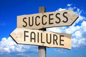 Success, Failure - Wooden Signpost with Two Arrows, Sky with Clouds in Background