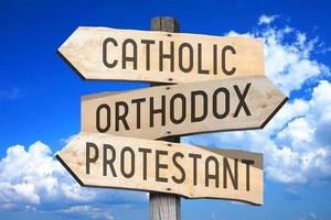 Catholic, Orthodox, Protestant - Religion Concept - Wooden Signpost with Three Arrows photo