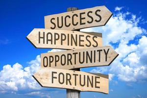 Success, Happness, Opportunity, Fortune - Wooden Signpost with Four Arrows, Sky with Clouds in Background photo