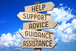 Help, Support, Advice, Guidance, Assistance - Wooden Signpost with Five Arrows photo