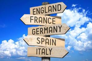 England, France, Germany, Spain, Italy - Countries Concept - Wooden Signpost with Five Arrows photo