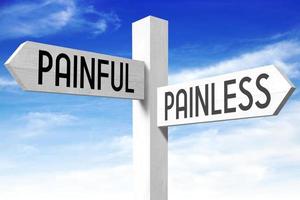 Painful, Painless - Wooden Signpost with Two Arrows and Sky in Background photo