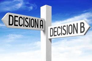 Decision A, Decision B - Wooden Signpost with Two Arrows and Sky in Background photo