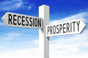 Prosperity, Recession - Wooden Signpost with Two Arrows and Sky in Background photo