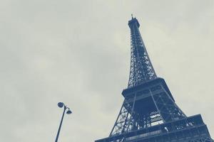 view on Eiffel tower and street lamp in Paris photo