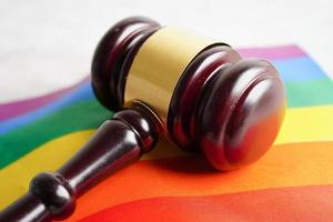 Gavel for judge lawyer with heart rainbow flag, symbol of LGBT pride month. photo