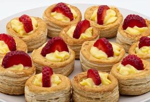 Sweet homemade Vol au vent filled with cream and strawberry photo