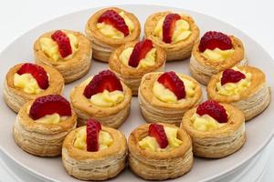 Sweet homemade Vol au vent filled with cream and strawberry photo