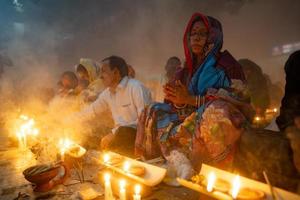 Narayanganj, Dhaka, Bangladesh, on November 12, 2022, Devotees offering prayers at the Shri Shri Lokanath Brahmachari Ashram temple during the Hindu religious fasting festival of Rakher Upobash. photo