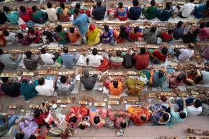 Narayanganj, Dhaka, Bangladesh, on November 12, 2022, Devotees offering prayers at the Shri Shri Lokanath Brahmachari Ashram temple during the Hindu religious fasting festival of Rakher Upobash. photo