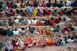 Narayanganj, Dhaka, Bangladesh, on November 12, 2022, Devotees offering prayers at the Shri Shri Lokanath Brahmachari Ashram temple during the Hindu religious fasting festival of Rakher Upobash. photo