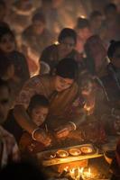 Narayanganj, Dhaka, Bangladesh, on November 12, 2022, Devotees offering prayers at the Shri Shri Lokanath Brahmachari Ashram temple during the Hindu religious fasting festival of Rakher Upobash. photo