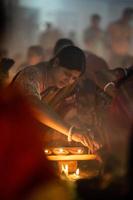 Narayanganj, Dhaka, Bangladesh, on November 12, 2022, Devotees offering prayers at the Shri Shri Lokanath Brahmachari Ashram temple during the Hindu religious fasting festival of Rakher Upobash. photo