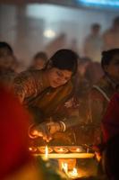 Narayanganj, Dhaka, Bangladesh, on November 12, 2022, Devotees offering prayers at the Shri Shri Lokanath Brahmachari Ashram temple during the Hindu religious fasting festival of Rakher Upobash. photo