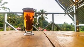 cup of tea on a wooden table photo