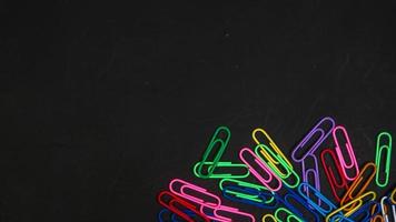 Paper clip isolated on a black background photo