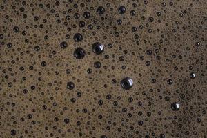 close up of coffee foam bubbles photo