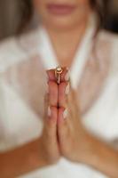 Wedding Rings Between Fingers. photo