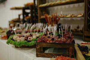 Beer Snack Mix with Dried Salted Seafood Top View and Flat Lay on Stone Table. Wine Snacks Buffet such as Spicy Squid, Mussels, Fish Fillet, Grilled Tiger Shrimp, Boiled King Prawns with Sauce photo