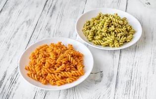 Fusilli with traditional and tomato pesto photo