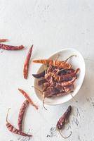 Bowl of dried chili peppers photo