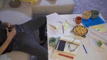 Lazy man falling asleep while watching tv. Messy and lazy man falls asleep while watching tv. video