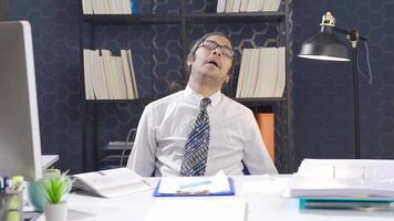 Tired businessman napping in the office. Funny lazy office worker napping at workplace video