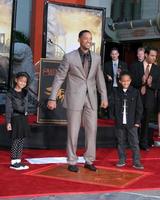 Will Smith with his kids Willow  JadenWill Smith Handprint and Footprint Ceremony Graumans Chinese Theater ForecourtDecember 10 2007Los Angeles CA2007 photo