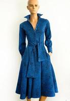 Gorgeous blue jacquard dress with a pattern. midi length. Collar. Buttons. Skirt. Wide sash belt. Mannequin in clothes on a white background. photo