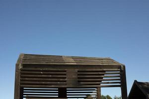 Roof of house made of boards. Building of lags. Architectural details. photo