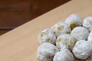 a close up of durian-flavored mochi served on a cutting board and ready to be eaten. photo