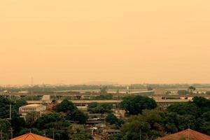 Capital city are covered by heavy smog,Misty morning and sunrise in downtown with bad air pollution photo