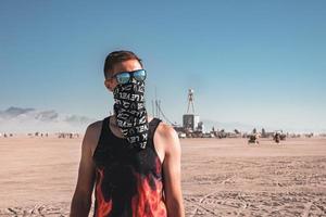 People walking towards sunset at a festival in the desert at the Burning Man Festival. photo