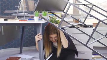 Having a terrible and violent earthquake. The cupboard fell on the woman who was stuck in the office during the earthquake and she waits desperately and is afraid. video