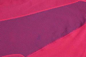 Synthetic fabric texture, red plaid, beautiful background pattern. Fragment of thermal underwear fabric. photo