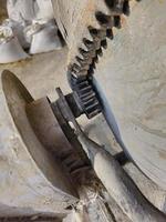 The gearing mechanism of the gearbox of a small concrete mixer. photo