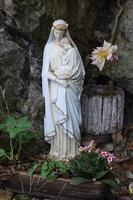 white statue of holy mary in the forest photo