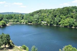 caldera lake Ulmener Maar in summer photo