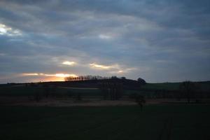 early dusk light in the clouds photo