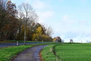 narrow farm road next to the mainr oad photo