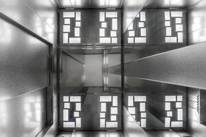 led lamps tiled on the ceiling of the elevator photo