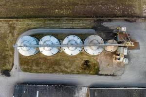 aerial view of agro-industrial complex with silos and grain drying line photo