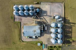 aerial view of agro-industrial complex with silos and grain drying line photo