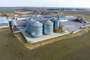 aerial view of agro-industrial complex with silos and grain drying line photo