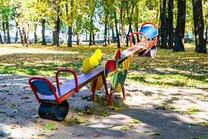 Photography on theme empty playground with metal swing for kids photo