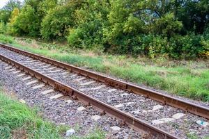 Photography to theme railway track after passing train on railroad photo